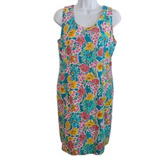 70's  sheath vintag70's  floral dress, 70's flower power dress, vintage Size 12This stunning vintage sheath dress is a must-have for any fashion-forward woman. With a beautiful floral pattern and vibrant multi-color palette, it's perfect for any casual occasion. The dress is made from a comfortable cotton blend material and features a shoulder-to-shoulder measurement of 13.5 inches, making it a great fit for a Size 12 figure. The dress has a mod/go-go style and a vintage look that's sure to turn heads. It was originally designed in the 1970s by Betsy Lauren and has since been preserved in Indonesia. The dress is 36 inches long and is perfect for any woman who wants to add a touch of vintage flair to her wardrobe. Fitted Sleeveless Dress With Floral Print, Fitted Floral Print Sleeveless Dress For Vacation, Vintage Sheath Dress For Summer, Summer Sleeveless Sheath Dress With Floral Print, Fitted Green Sleeveless Dress With Floral Print, Summer Floral Print Sheath Dress, Fitted Floral Print Sleeveless Sheath Dress, Sheath Sleeveless Dress For Summer, Retro Fitted Floral Summer Dress