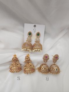 Elevate your special day with these antique earrings by funcre8tions. Featuring beautiful patterns , it’s a fresh take on classic antique jewelry. The antique gold-tone finish and high quality stones perfectly complements these drop earrings. Whatever the occasion, it will add traditional edge to timeless styling. Details & Specifications: Materials used: Brass Alloy with Antique Plating Length - 2.5 inches Wedding Jhumkas With Intricate Brass Design, Brass Jhumkas With Intricate Design For Wedding, Wedding Brass Jhumkas With Intricate Design, Heavy Brass Jhumkas For Wedding, Bollywood Brass Danglers For Wedding, Brass Jhumkas For Wedding, Wedding Temple Jewelry Brass Danglers, Temple Jewelry Brass Danglers For Weddings, Festive Jhumkas With Peacock Design