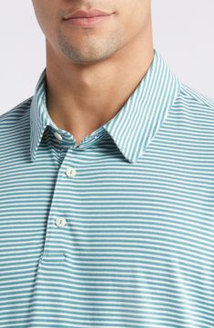 Jaunty stripes enliven a soft, comfy stretch-cotton polo knit with S-twist and Z-twist yarns for durability and shape retention. Button half placket Spread collar Short sleeves 97% cotton, 3% spandex Machine wash, tumble dry Imported Casual Striped Polo Shirt For Golf, Casual Golf Tops With Contrast Stripes, Striped Cotton Tops For Golf, Classic Striped Tops For Golf, Casual Striped Golf Tops, Casual Golf Tops With Striped Collar, Casual Striped Tops For Golf, Casual Tops With Striped Collar For Golf, Jean Shirt Men