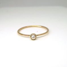 Elegant and dainty pearl ring in 14k gold filled! Perfect for your bridesmaids, graduation gift for your loved ones, or simply for yourself! They are great by themselves and are also stackable with other rings as pictured. Pearl is June birthstone What you will receive.. ONE 1mm 14K yellow gold filled ring with 3mm genuine white fresh water pearl For 14k solid gold option, please contact me!! All items are handmade with love and care in my little studio! If you have a sizing question or a specia 14k Yellow Gold Rings With Pearl Charm, Stackable 14k Gold Pearl Ring With Round Band, Dainty 14k Yellow Gold Moonstone Ring, Dainty 14k Gold Solitaire Opal Ring, Dainty Tiny Birthstone Ring For Wedding, Minimalist Everyday Yellow Gold Pearl Ring, Everyday Minimalist Yellow Gold Pearl Ring, Fine Jewelry Stackable Pearl Promise Ring, Gold Everyday Pearl Ring With Pearl Drop