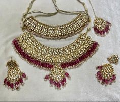 Tyaani inspired Red and Gold Indian / Pakistani Jewellery Set - Choker Necklace and Earrings. Sabyasachi inspired. PACHI KUNDAN (gold plated) We have a large inventory - message us what shade you are looking for or send picture of your outfit to match. Fast shipping - Canada & USA "Life is better ... with a Touch of Elegance". Message for any questions. Heavy Red Wedding Sets, Heavy Red Traditional Wear For Festive Occasions, Red Heavy Lehenga For Wedding, Festive Red Chandbali Bridal Set, Red Chandbali Bridal Necklace For Wedding, Elegant Red Kundan Necklace For Wedding, Red Bollywood Bridal Sets With Zari Work, Bollywood Style Red Bridal Sets With Pallu, Red Bollywood Bridal Sets With Pallu