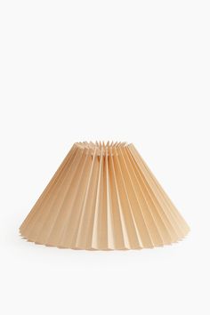 a brown paper lamp shade on a white background