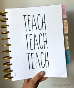 a hand holding up a piece of paper with the words teach teach written on it