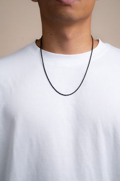 This stainless steel rope chain is made from premium quality 316L stainless steel. The steel has been plated black to give the chain a sleek and sophisticated look. The chain is durable and made for everyday wear. Stainless steel is hypoallergenic, resistant to tarnishing and waterproof! Making it perfect for those who have sensitive skin. Chain Thickness: 2 mm Length: 18", 20", 22" Clasp: Lobster Claw Materials: 316L Stainless Steel Water and Sweat Resistant Hypoallergenic Recommended length fo Black Rope Chain Necklace As Gift, Black Link Necklace With Adjustable Chain, Black Box Chain Link Necklace, Minimalist Black Cable Chain Necklace, Minimalist Black Chain Necklace With Adjustable Chain, Black Link Jewelry With Box Chain, Black Adjustable Chain Necklace For Everyday, Minimalist Stainless Steel Rope Chain Jewelry, Everyday Black Link Chain Necklace