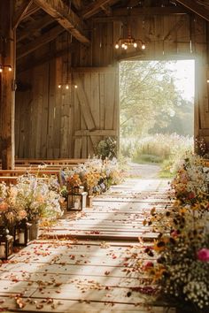 the inside of a barn with lots of flowers