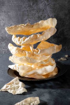 A pile of poppadoms on a plate against a grey background. Poppadoms Recipe, Indian Dips, Fav Food, Easy Asian Recipes