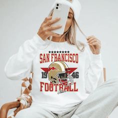 Perfect sweatshirt for Nick Bosa and San Francisco football fans this season! Ideal for any situation, a unisex heavy blend crewneck sweatshirt is pure comfort. These garments are made from polyester and cotton. This combination helps designs come out looking fresh and beautiful. The collar is ribbed knit, so it retains its shape even after washing. There are no itchy side seams on these sweaters.  .: 50% cotton, 50% polyester .: Medium-heavy fabric (8.0 oz/yd² (271.25 g/m .: Loose fit .: Sewn-in label .: Runs true to size CARE INSTRUCTIONS: -Please wash all clothing items INSIDE OUT to preserve the design. -Please wash all clothing items on cold, and dry on Medium- low heat. -DO NOT IRON. -DO NOT TIE DYE. **Please check our color and size charts before you place your order. If you have an Fleece Sweatshirt With Team Logo For Fan Merchandise, Fleece Sweatshirt Fan Apparel, Football Season Fan Merchandise Long Sleeve Hoodie, Fan Merchandise Long Sleeve Hoodie For Football Season, Fan Apparel Crew Neck Hoodie, Fleece Sweatshirt With Team Logo, White Fan Apparel Hoodie Sweatshirt, Fan Apparel Sweatshirt With Team Logo For Streetwear, Streetwear Fan Apparel Sweatshirt With Team Logo