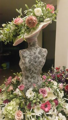 there is a vase with flowers on top of it