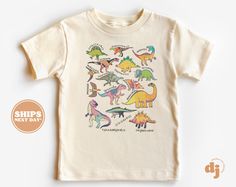 Toddler T-shirt - Types of Dinosaurs Kids Retro TShirt - Cute Retro Natural Infant, Toddler & Youth Tee #5910 All of the shirts and bodysuits at our shop are CPSIA compliant. We only use Eco-friendly, water-based inks that are also CPSIA compliant and boasts strong washability (highest score on AATCC wash test).  So rest assure to put them on your little ones!  ** COLOR OF T-SHIRTS WILL VARY SLIGHTLY DUE TO LIGHTING AND/OR MONITOR SETTINGS ** DETAILS OF BABY BODYSUITS & T-SHIRTS MAY VARY SLIGHTL Fun Short Sleeve T-shirt With Dinosaur Print, Fun Short Sleeve Dinosaur Print T-shirt, Unisex White Top With Dinosaur Print, Fun Summer T-shirt With Dinosaur Print, White Dinosaur Print T-shirt For Summer, Fun Short Sleeve Tops With Dinosaur Print, Unisex White T-shirt With Dinosaur Print, Dino Names, Types Of Dinosaurs