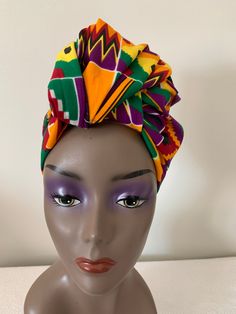 This African inspired fabric headwrap is made from 100% soft cotton. The colors are orange, yellow, green, purple and red.  The headwrap measures 71" x 22". Please keep in mind, like any fabric you need to be gentle with your pieces. In order to keep the colors vibrant you can either hand wash, or use gentle washing machine cycle in cold water or lukewarm water. Using hot water will cause your fabric to shrink. Please note you will need to tie the head-wrap yourself. Current style in the pictures is for advertising only. Yellow Headwrap Headband One Size, Yellow Headwrap Headband One Size Fits Most, Yellow Headwrap One Size Fits Most, Yellow One Size Fits Most Headband Headwrap, Adjustable Yellow Bohemian Headwrap, Multicolor Cotton Bandana, Multicolor Bandana With Matching Headband For Festival, Bohemian Multicolor Cotton Bandana, Traditional Multicolor Headwrap With Matching Headband