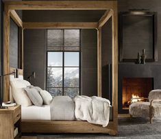 a bedroom with a canopy bed and fireplace