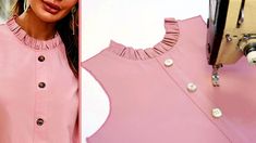 a woman is wearing a pink top with buttons on the front and side, while she has