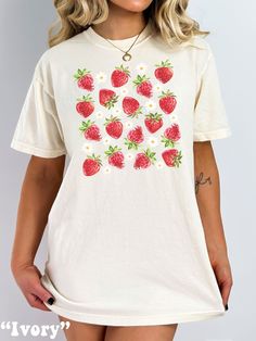 Enjoy the Cottagecore Aesthetic with this cute Strawberry Shirt! Comfort Colors® Tshirts are super comfy! Size up for a Trendy Oversized look! Cottage Core is a unique trend to express your love for Nature! I've added little daisies to give it that extra something special! ♥ Hello and Welcome to Meaningful Tees Shop! ♥ Models are wearing Comfort Colors® Ivory, Banana, and Blossom ♥ All of our items are made one at a time with care for each customer : ) ♥ Please allow 3-7 BUSINESS days (usually 3-5) for your item to be created PLUS shipping time via USPS ♥ UNISEX TEES fit like a Mens Shirt on Women, but are not overly large. ♥ For a RELAXED FIT, your usual size will typically work, but please consult the Size Chart in the Listing Photos ♥ For a TRENDY OVERSIZED FIT, size up 1, 2, or 3 Sizes Strawberry Tshirt, Strawberry T Shirt, Strawberry Aesthetic, Strawberry Shirt, Comfort Colors Tshirt, Cute Strawberry, Aesthetic Cute, Cottagecore Aesthetic, Trendy Shirts