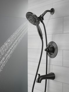 an open shower head with water running from it