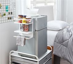 a small refrigerator in the corner of a room