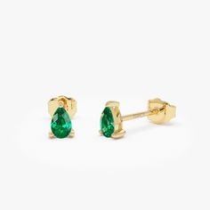 Experience sophistication with our Emerald Teardrop Studs, meticulously crafted from 14K solid gold. These pear-shaped emerald cut earrings exude minimalist elegance, perfect for celebrating the May birthstone or adding a touch of refinement to any ensemble. An ideal choice for a dainty birthday gift, these earrings radiate timeless charm and style. Features: * Made to Order * Gold Kt: 14K Solid Gold (also available in 18K) * Available Gold Colors: Yellow Gold, White Gold * Pear Shape Emerald: 2 Classic Teardrop Pear-shaped Earrings As Gift, Classic Teardrop May Birthstone Earrings, Classic Teardrop Earrings For May Birthstone, Minimalist Pear-shaped Yellow Gold Earrings, Classic 14k Gold Pear Shaped Earrings, Classic Pear-shaped May Birthstone Earrings, 14k Gold Pear-shaped Teardrop Earrings Gift, 14k Gold Teardrop Earrings For Anniversary, 14k Gold Teardrop Pear-shaped Earrings