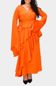 Get ready for your close-up in a ruffle-decked dress that delivers on the drama from the voluminous sleeves to the ankle-skimming length. A soft stretch-jersey fabrication adds to the devastating drape. 60" length (size 1X) Slips on over head Surplice V-neck Long sleeves 95% polyester, 5% spandex Machine wash, tumble dry Made in the USA of imported fabric Asian & Pacific Islander Owned/Founded High Neck Midi Dress, Maxi Bodycon Dress, Pacific Islander, Voluminous Sleeves, Midi Shift Dress, Flowy Sleeves, Extra Long Sleeves, Ruffle Long Sleeve, Mini Skater Dress