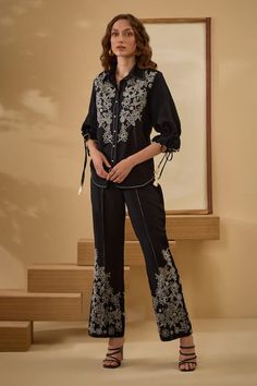 Black shirt featuring contrast white thread embroidery with scallop hem sleeves. Paired with an embroidered pant. - Aza Fashions Elegant Embroidered Summer Pant Set, Elegant Embroidered Pant Set For Work, Elegant Cotton Pant Set With Floral Embroidery, Embroidered Straight Pant Set For Office, Embroidered Straight Pant Set For Work, Embroidered Long Sleeve Pant Set For Summer, Elegant Cotton Sets With Embroidered Cuffs, Traditional Embroidered Pant Set For Workwear, Elegant Embroidered Cotton Pants