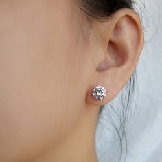 Bring a little bit of style to your look with these chic CZ Solitaire Stud Earrings. These uniquely designed earrings present a fantastic way to highlight your best features while making you look exceptionally stylish. These earrings are high diversified pieces of jewelry that can be teamed with diverse types of dresses. They undeniably give a touch of sophistication to your appearance while adding an element of status. Features: Comfortable to wear Lightweight High quality Tarnish resistant But Glamorous Round Diamond Crystal Earrings, Elegant Diamond White Crystal Earrings With Halo Design, Classic White Gold Crystal Earrings With Cubic Zirconia, Diamond White Cubic Zirconia Round Cut Crystal Earrings, Classic Crystal Earrings With Prong Setting, Dazzling Diamond White Cubic Zirconia Cluster Earrings, Dazzling Round Cut Earrings With Sparkling Stones, Brilliant Cut Cubic Zirconia Bridal Earrings, Round Brilliant Cut Cubic Zirconia Bridal Earrings