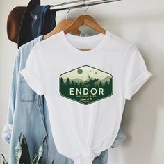 a t - shirt with the words endor on it hanging from a clothes rack