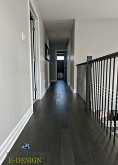 Dark hallway with dark oak wood flooring, wood hand railing, metal black spindles, white trim. 

#darkwood #homeupdate #paintcolors #diy #kyliem Paint Colors With Dark Wood, Benjamin Moore Collingwood, Hallway Paint Colors, Bright Paint Colors, Light Grey Paint Colors, Light Paint Colors