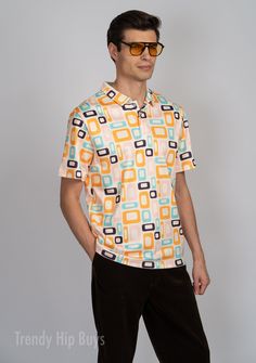 Introducing our Retro Polo Shirt for Men, a unique and artistic piece that seamlessly blends vintage style with modern sophistication. This Vintage Style Polo Shirt features a captivating multicolor geometric rectangle mid-century modern pattern print in shades of orange, pink, brown, blue, and beige. With influences from the iconic 60s and Mod Shirt Men aesthetics, this shirt stands out as a fashion-forward choice.Crafted from a premium blend of 95% polyester and 5% spandex, this Men's Polo Shirt ensures a comfortable fit, durability, and maintains its shape over time with no shrinkage or pilling. The absence of a pocket contributes to the sleek look, allowing the geometric pattern to take center stage. Whether as a unique addition to your Man Clothing collection or a thoughtful gift for Men Aesthetics, Fab Frocks, Style Polo Shirt, Man Clothing, Mid Century Modern Patterns, Modern Boutique, Shades Of Orange, Historical Society, Sleek Look