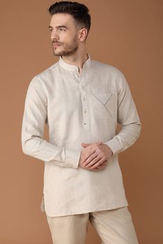 Yell's signature linen kurta returns! This time, in earthy natural tones with blue jali stitch adding the perfect element of surprise. Blue contrast inside collar and pocket adds a new dimension to this 100% linen kurta. Paper Cotton Kurta For Men, Linen Shirt Designs Men, Khadi Dresses Indian, Casual Long Sleeve Beige Kurta, Casual Beige Long Sleeve Kurta, Beige Long Sleeve Casual Kurta, Casual White Linen Kurta, Traditional Long Sleeve Linen Kurta, Relaxed Fit Long Sleeve Linen Kurta