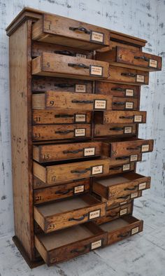 an old wooden dresser with many drawers