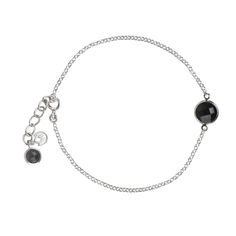 Delicate link chain bracelet in sterling silver with Faceted Black Onyx gemstone. The bracelet is 7 inches long plus 1 inch extension. The bracelet has a lobster lock clasp. The bracelet features a 8mm black onyx in the center and 5mm stone hanging in the end. Wear this bracelet on its own or layer it with our other bracelets. The bracelet comes packed in a box. Delivery: We try to ship the order the same working day if ordered before 12pm. We use Royal Mail 24, for U.K. , and, Royal Mail signed and tracked for International deliveries. Elegant Black Chain Bracelets, Elegant Black Chain Bracelet, Black Sterling Silver Chain Bracelet, Elegant Black Chain Bracelet With Adjustable Chain, Elegant Black Chain Bracelet With Silver Chain, Adjustable Black Jewelry With Silver Chain, Black Jewelry With Adjustable Silver Chain, Elegant Black Bracelet With Adjustable Chain, Adjustable Black Chain Bracelet