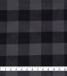 a black and gray checkered fabric with a ruler