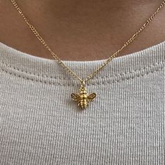 Honey Bee Necklace The honey bee symbolizes dedication, community and work ethic -  associated with the both hard work and the sweetness of life, the honey been is a reminder to stay in balance. - Gold Vermeil Honey Bee Charm - 14k Gold-filled 1.4mm Figaro Chain  - Length: 16, 18, 20 inches  - Hypoallergenic, water resistant, non-tarnish Handmade Honey Color Jewelry Gift, Handmade Honey Jewelry For Gift, Handmade Honey-colored Jewelry For Gifts, خواتم خطوبة, Preppy Jewelry, Bee Necklace, Bee Charms, Work Ethic, Pretty Jewelry