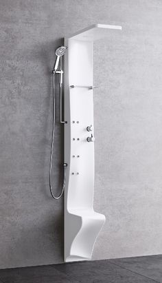 a white shower in a bathroom next to a gray wall