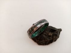 "Dark green Emerald, Malachite stone, For women, For men, Gift for her, gift for him, Gift for boyfriend, Stone ring, Raw stone rings, Unisex. The ring in the photo is 5mm width. This can be customized. This is an exclusive model of Woodlife Jewelry. Damascus steel band, beveled edges, mix Malachite stone and Dark green Emerald stone inside and a 1 mm outer line with stone. Customize your ring by choosing the birthstone: January - Garnet February - Amethyst March - Aquamarine, Bloostone April - Handmade Green Rings For Gifts, Handmade Green Promise Ring, Handmade Adjustable Green Emerald Ring, Handmade Nature-inspired Emerald Ring For Anniversary, Nature-inspired Emerald Rings For Gift, Handmade Adjustable Emerald Promise Ring, Handmade Round Emerald Ring As A Gift, Adjustable Green Turquoise Ring As Gift, Adjustable Green Turquoise Ring Gift