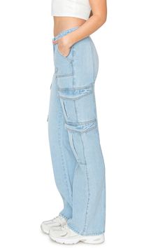 95% Cotton, 4.85% Rayon, 0.15% Polyester Feature: These full-length, flared-leg cargo jeans feature a low-waisted fit complemented by functional side cargo pockets with flaps, deep front pockets, seam detailing, a D-ring point at the belt loop, button closure, and zipper fly. The low-rise cargo trend in these jeans makes them the perfect choice for daily wear, weekend getaways, date nights, and more. Discover more cool California vibes in our KHAKI & BLUE Denim Collection. Versatile Style: Pair California Vibe, Denim Collection, Cargo Jeans, Low Waisted, Sporty Look, Versatile Style, Crop Tee, D Ring, Weekend Getaways