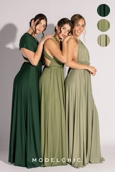 three women in long dresses standing next to each other with their arms around one another