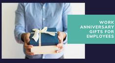 a man holding a gift box with the words work anniversary gifts for employees