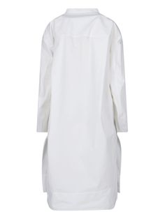 Khaite 'Brom' white cotton maxi dress with V-neck, button detail, two side pockets, side slits, straight hem. Composition: 100% Cotton Long White Cotton Shirt Dress, White Long Shirt Dress For Work, White Long Dress For Work, White Oversized Button Dress, White Oversized Buttoned Dress, Oversized White Dress With Buttons, Long White Dress For Work, Oversized White Buttoned Dress, White Maxi Length Shirt Dress For Daywear