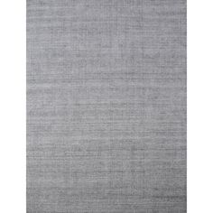 an area rug with grey and white colors