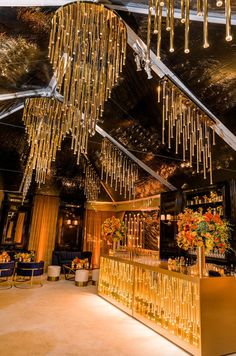 the interior of a restaurant with chandeliers hanging from the ceiling