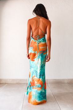 Our gorgeous best-selling Sunset Views maxi dress is back in 2 new colors - the perfect dress for any special occasion. Luxe crinkle satin aqua/orange maxi dress Adjustable string tie with gold chain detail Cowl neck bust and low draped back Side pleating RUNS BIG! Size down one size from your normal size for this item. Ex: if you are normally a medium, order the small Sofia is wearing the Xsmall- she is normally a small. Non lined, non stretch fabric Polyester, Hand wash cold Also available in our NAPA color way (olive/coral) All orders will be shipped by May 21st Sofia's measurements - Height 5'8, Bust 32B, Waist 27 in , Hips 34 in. She normally wears a size small in tops, a size 2 in dresses, and a size 3/25 in jeans. Cowl Neck Dress Orange, Selling Sunset Dress, Gala Night, Selling Sunset, Orange Maxi Dress, Vintage Swim, Guest Attire, Wedding Attire Guest, Satin Maxi