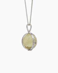 The Spinning Globe Stone Pendant showcases a rotating faceted lemon quartz stone globe, encased in a sterling silver housing with our signature reef texture. This ocean-inspired texture replicates the intricate patterns found in a reef. Metal: Sterling silver Stone: Lemon quartz Dimensions: 29mm Stone Size: 18mm Style #: OP03Lq Luxury Faceted Silver Jewelry, Luxury Sterling Silver Jewelry With Large Stone, Artisan Necklace With Round Stone Pendant, Luxury Silver Locket Jewelry, Fusion Style Faceted Round Jewelry, Fusion Style Faceted Sterling Silver Jewelry, Silver Faceted Round Pendant Jewelry, Sterling Silver Jewelry With Faceted Round Stone, Elegant Gemstone Jewelry Keepsake