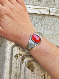 Handcrafted by skilled Tuareg artisans, this unisex ethnic style stone bracelet reflects the craftsmanship and attention to detail that goes into creating such a beautiful piece. The shine of the silver and the intense red of the carnelian in the center make this bracelet an essential accessory for you if you are looking for an elegant piece to add to your jewelry collection. º Materials: sterling silver and carnelian º Length: 17 cm/ 6.70 Inches º Width: 4 cm / 1.57 Inches º Weight: 40 Grams / Carnelian Bracelet Jewelry Gift, Vintage Carnelian Bracelets As Gift, Vintage Carnelian Bracelets Gift, Vintage Carnelian Bracelet Gift, Vintage Healing Bracelet, Vintage Healing Bracelets, Vintage Healing Bracelet Jewelry, Carnelian Natural Stone Bracelet, Traditional Oval Bracelets As Gift