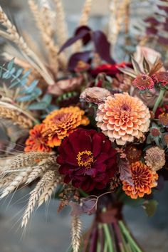 a vase filled with lots of different types of flowers