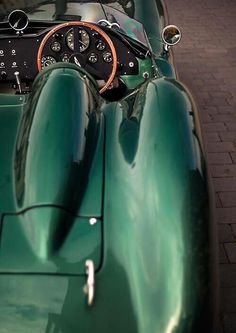 the interior of an old green sports car