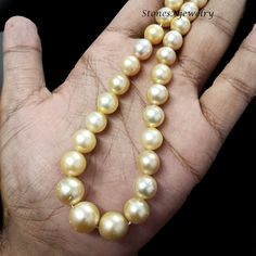 Golden South Sea Pearl Beaded Necklace, Genuine Golden South Sea Pearl Round Beads Necklace, South Sea, 7-13mm Pearl Beaded Necklace Gift        Stone - Golden South Sea Pearl Size - 7-13mm Shape - Round Color - Gold Color Necklace Strand Length - 16 Inch Hand-strung Pearl Jewelry With Round Beads, Hand-strung Round Pearl Bead Jewelry, Single Strand Round Pearl Necklace, Classic Beaded Necklaces With 8mm Round Beads, Yellow Pearl Necklaces With Round Beads, Single Strand Pearl Necklace With Round Beads, Round Pearl Necklace With Large Beads For Jewelry Making, Round Pearl Beads For Jewelry Making, Elegant 8mm Rondelle Beaded Necklaces