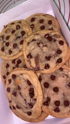 chocolate chip cookies in a white box on a table