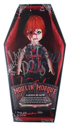 a doll with red hair and makeup on it's face in a black box