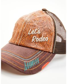 6 panel construction. Tooled leather design on front with brown mesh back. Velcro closure on back. Brown curved bill with multicolored stitching Adjustable Brown Snapback Hat With Curved Visor, Adjustable Brown Trucker Hat With Curved Visor, Adjustable Brown Six-panel Trucker Hat, Brown Baseball Cap For Rodeo, Brown Snapback Baseball Cap For Rodeo, Brown Leather Patch Trucker Baseball Cap, Adjustable Brown Baseball Cap For Rodeo, Brown Leather Trucker Baseball Cap, Brown Leather Trucker Cap