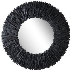 a mirror that is made out of black paper and some kind of sticks on it