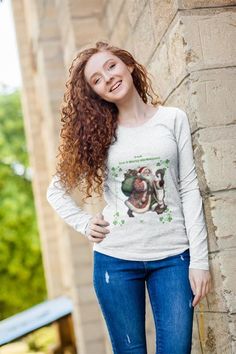 This Irish You A Merry Christmas Tee Shirt features Santa wearing green and four leaf clover accents, perfect for adding a touch of holiday spirit to your wardrobe. The unisex design makes it suitable for both men and women, making it a great gift for anyone looking to celebrate the festive season. Product features - Unisex Jersey Long Sleeve Tee - With side seams for structural support - Ribbed knit collar for shape retention - Shoulder tape for stability - Variety of fiber compositions for dif St. Patrick's Day Cotton Crew Neck Tops, Cotton Crew Neck Top For St. Patrick's Day, Green Long Sleeve T-shirt For Holiday, Christmas Tee Shirts, Green Clover, Jersey Long Sleeve, Clover Green, Christmas Tees, Unisex Design